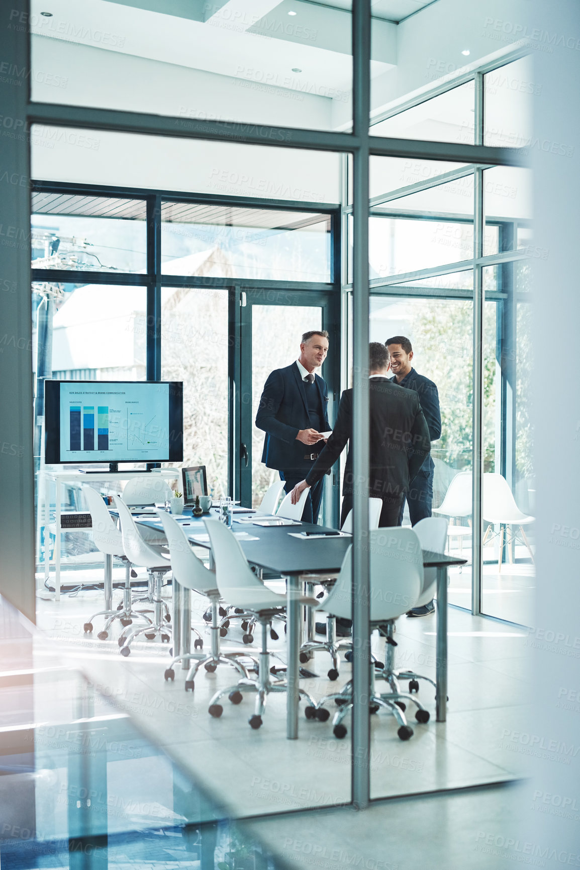 Buy stock photo Full length shot of a group of corporate businessmen meeting in the boardroom