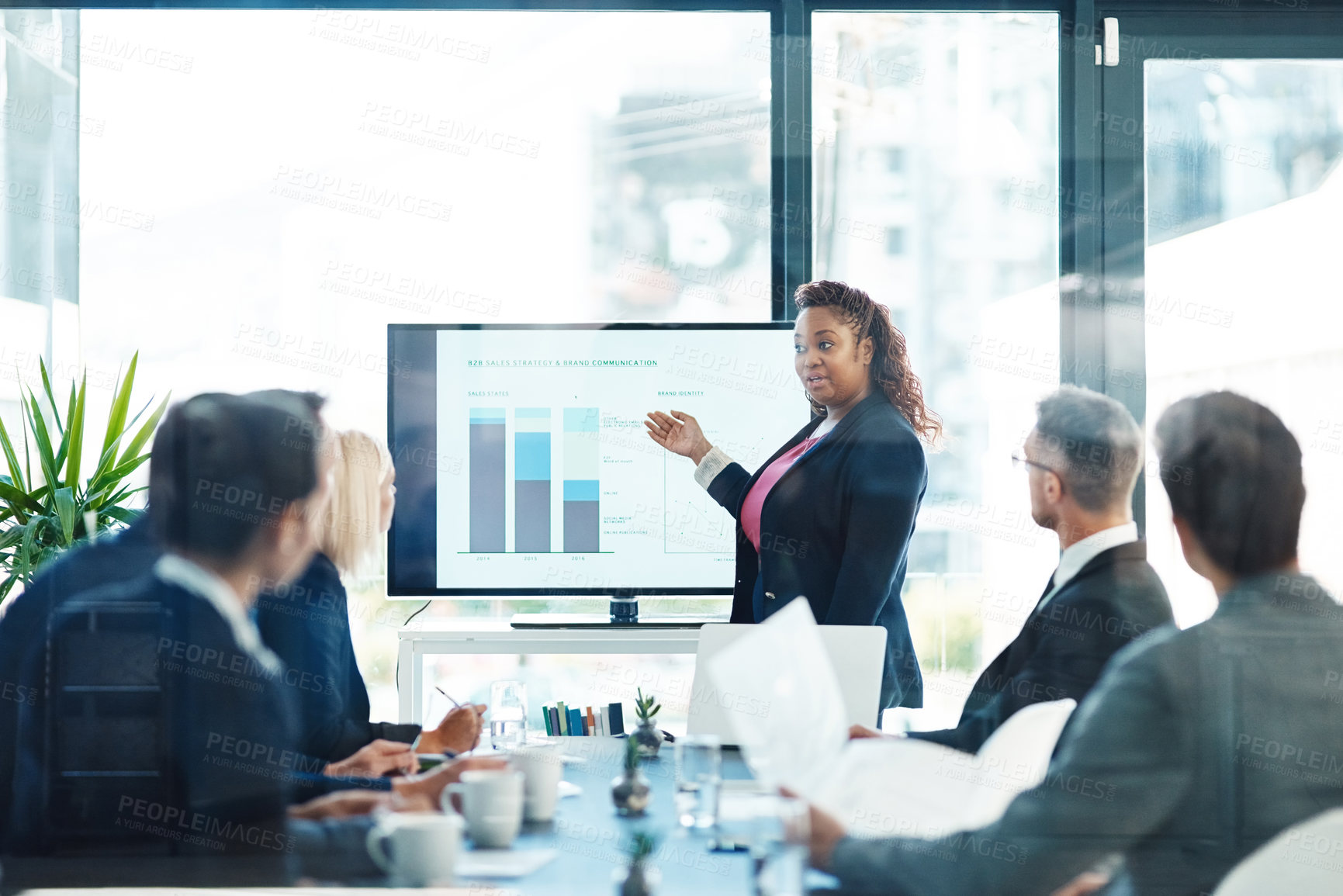 Buy stock photo Cropped shot of an attractive young businesswoman giving a presentation in the boardroom