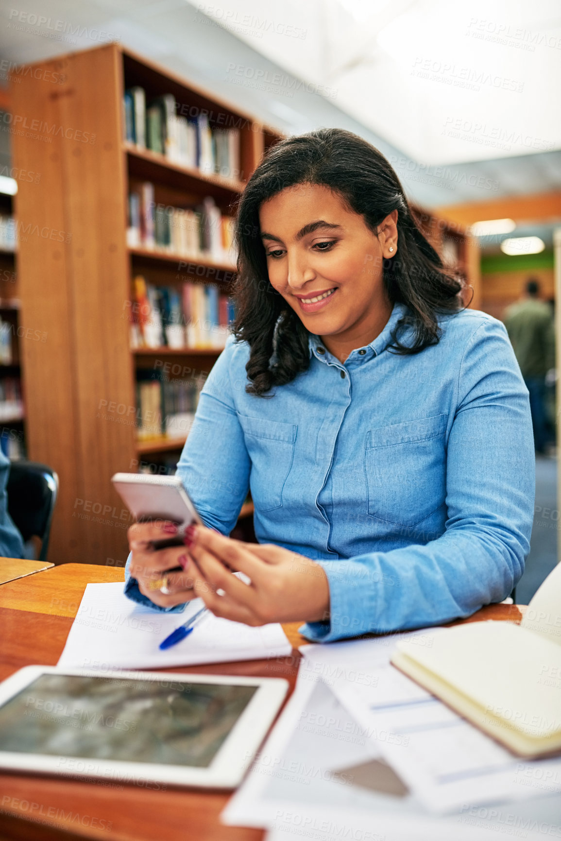 Buy stock photo Social media, student or happy woman with phone in library to research for education or studying at college. Texting, school and mobile app for elearning, course summary and scholarship at university