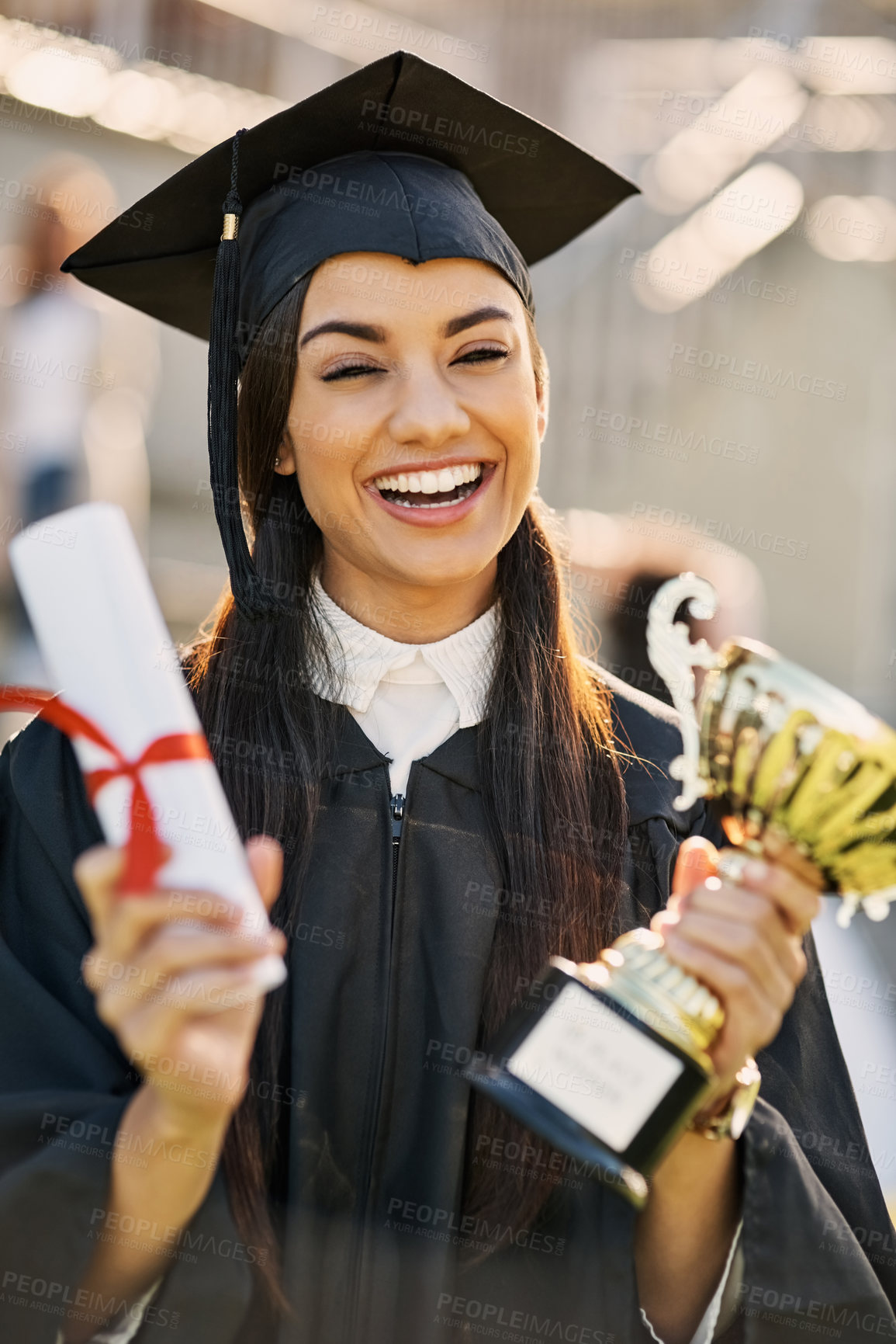 Buy stock photo Portrait of a student holding her diploma and trophy on graduation day