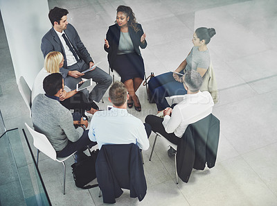 Buy stock photo Female leader, boss or manager talking to her team during a meeting for planning, strategy and company vision. Motivated group discussing the mission and vision for innovation, growth and development