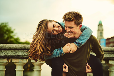 Buy stock photo Cropped shot of a young couple out on a date in the city