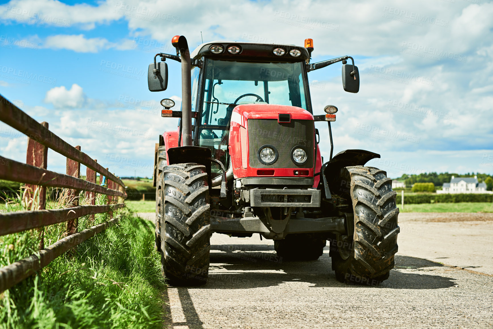 Buy stock photo Outdoor, farm and agriculture with tractor for tiling, plowing and cultivation of soil for crop growth. Blue sky, nature and machine truck in countryside for harvesting, planting and sowing of seeds