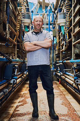 Buy stock photo Portrait, farmer and man with arms crossed, diary farm and industry with agriculture. Face, person or small business owner with confidence, pride or sustainability with machine, entrepreneur or smile