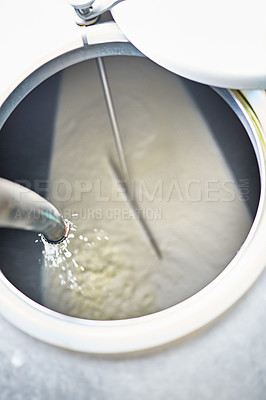 Buy stock photo Food, farming and milk in container for process, cheese production or pasteurisation in factory. Health, nutrition and cream in tank for dairy product, manufacturing and sustainable small business