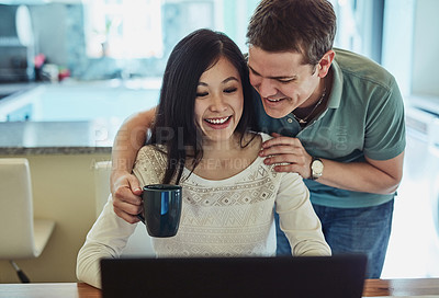 Buy stock photo Couple, laptop and hug with coffee for support with remote work, online research and copywriting project. People, happy freelancer and embrace entrepreneur in home with technology for editing report