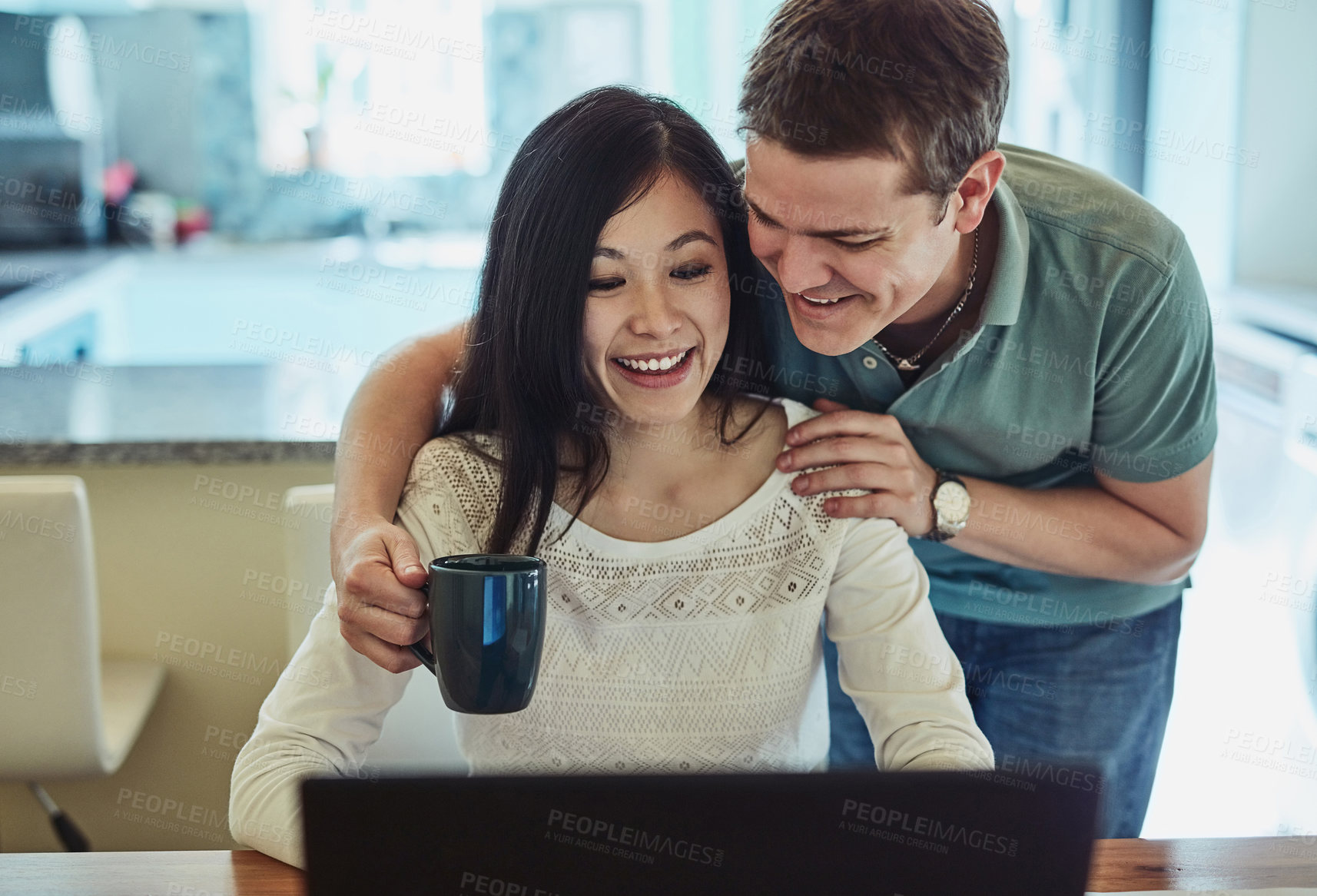 Buy stock photo Couple, laptop and hug with coffee for support with remote work, online research and copywriting project. People, happy freelancer and embrace entrepreneur in home with technology for editing report