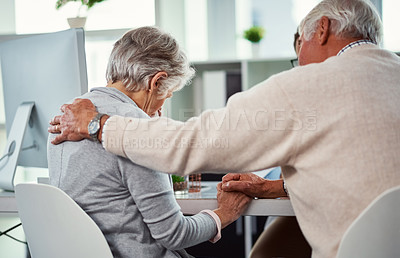 Buy stock photo Shot of a senior man consoling his wife in a clinic