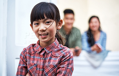Buy stock photo Portrait of a little girl relaxing with her family at home