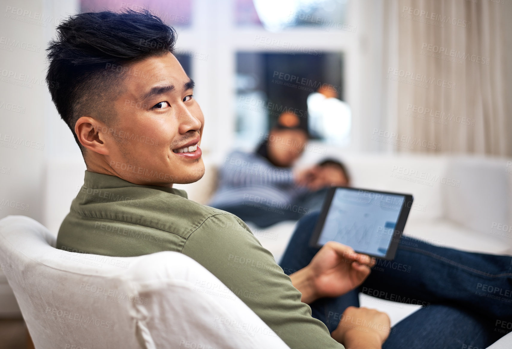 Buy stock photo Man, tablet and remote work on sofa in family home with review, charts or screen in living room. Asian person, graphs and click with tech, app and insight with project management in lounge at house
