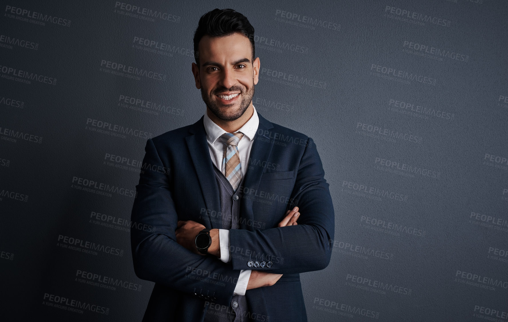 Buy stock photo Studio shot of a stylish and confident young businessman posing against a gray background