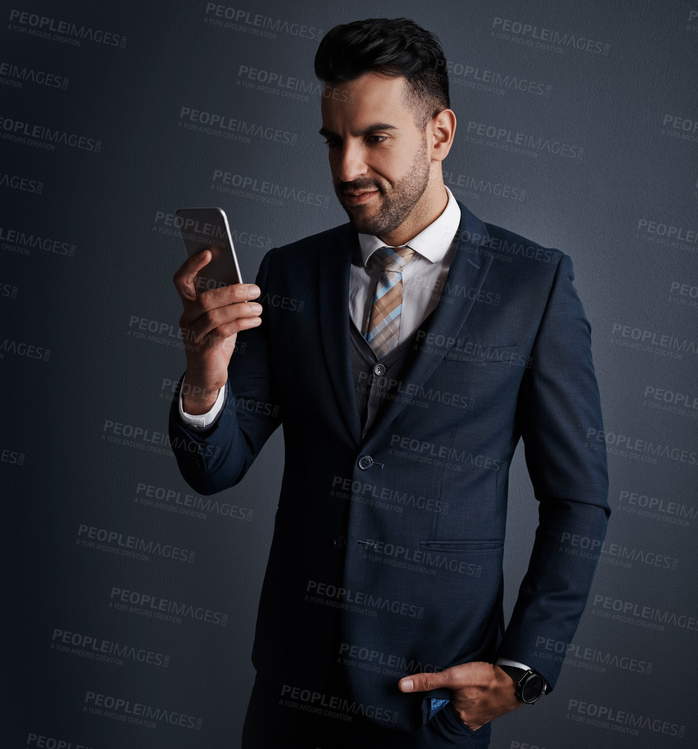 Buy stock photo Reading, businessman or happy with phone in studio for economy news, trading account or website. Trader, person and smile with smartphone on gray background for online investment or monitor portfolio