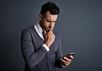 Managing business with his smartphone