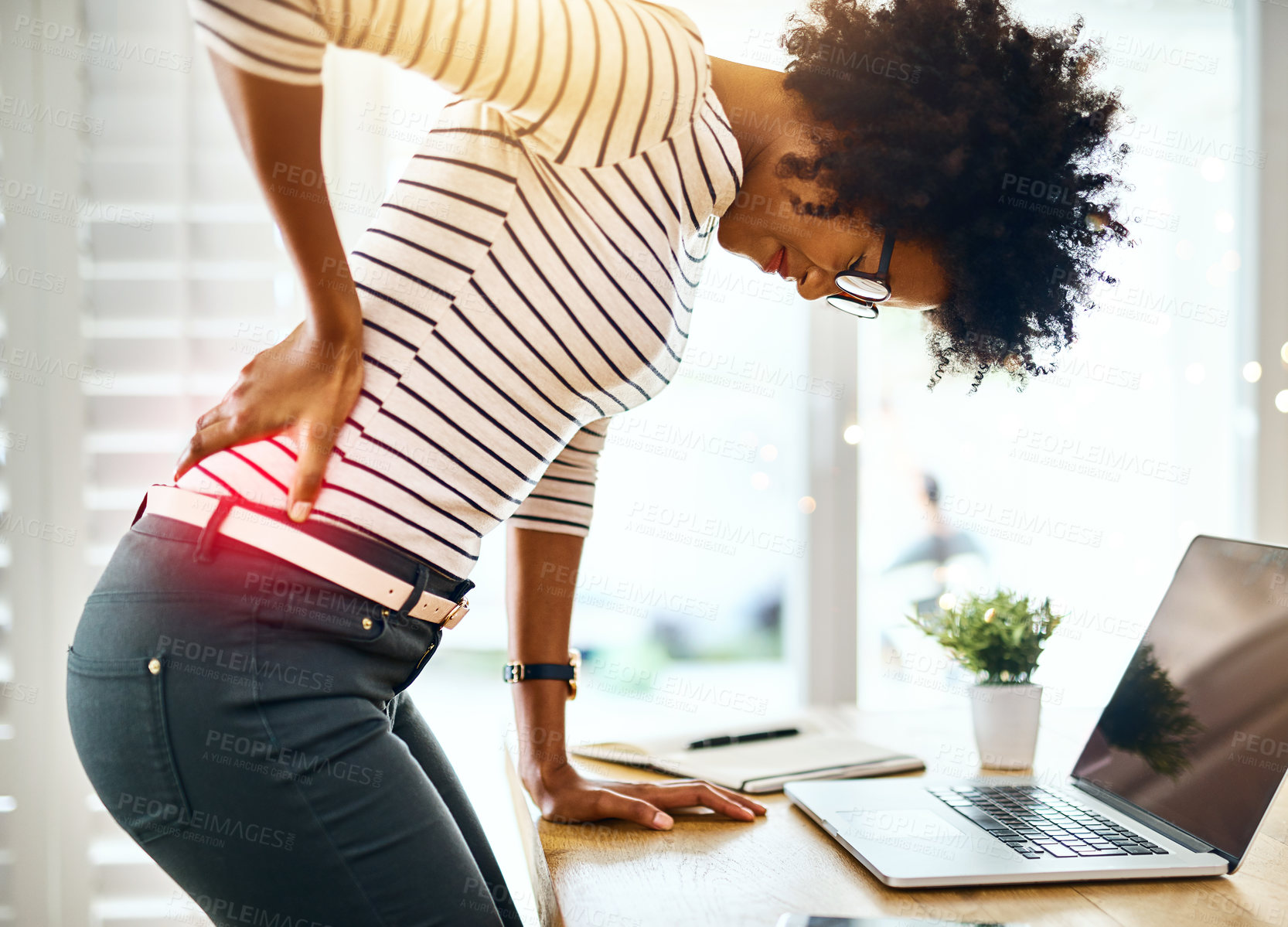 Buy stock photo Laptop, office and woman with back pain for stress, muscle injury and medical emergency for bad posture. Spine problem, health and tired girl for anatomy with red glow, inflammation and scoliosis