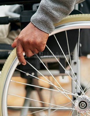 Buy stock photo Cropped shot of an unrecognizable senior man sitting in his wheelchair at home
