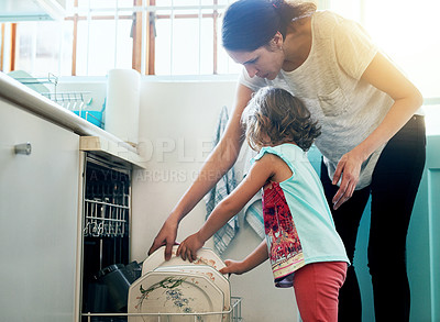 Buy stock photo Help, dishwasher and mom with girl in home for chores, teaching or learning hygiene routine. Housekeeping, mother and daughter cleaning kitchen together in support, care and child development at sink