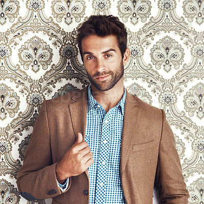 Buy stock photo Portrait, confidence and man in suit on a wallpaper background isolated in studio for vintage fashion. Face, style and person in clothes, blazer and retro pattern of classy model in Switzerland