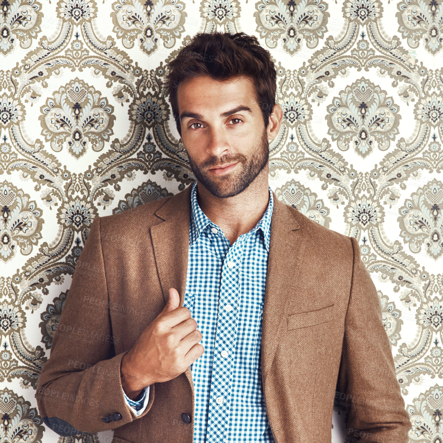 Buy stock photo Portrait, confidence and man in suit on a wallpaper background isolated in studio for vintage fashion. Face, style and person in clothes, blazer and retro pattern of classy model in Switzerland