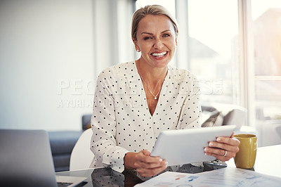 Buy stock photo Cropped shot of a mature businesswoman working from her home office