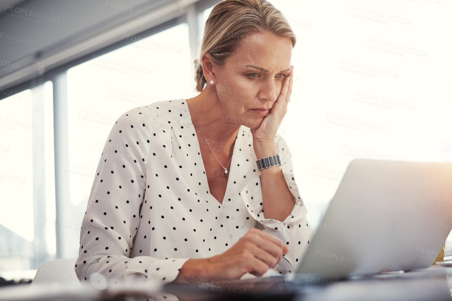 Buy stock photo Cropped shot of a mature businesswoman working from her home office