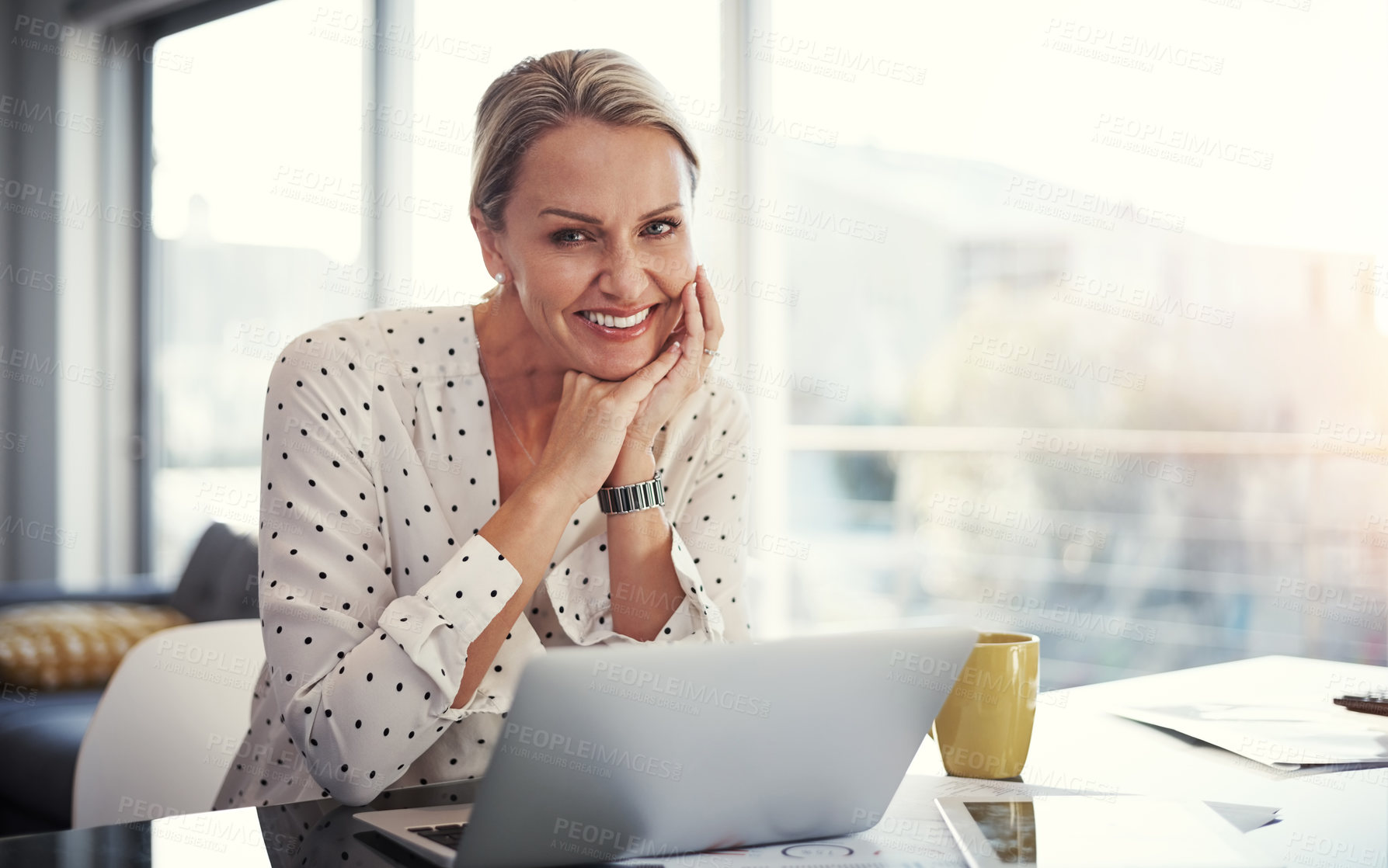 Buy stock photo Cropped shot of a mature businesswoman working from her home office