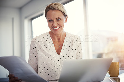 Buy stock photo Cropped shot of a mature businesswoman working from her home office