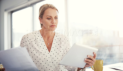 Buy stock photo Cropped shot of a mature businesswoman working from her home office