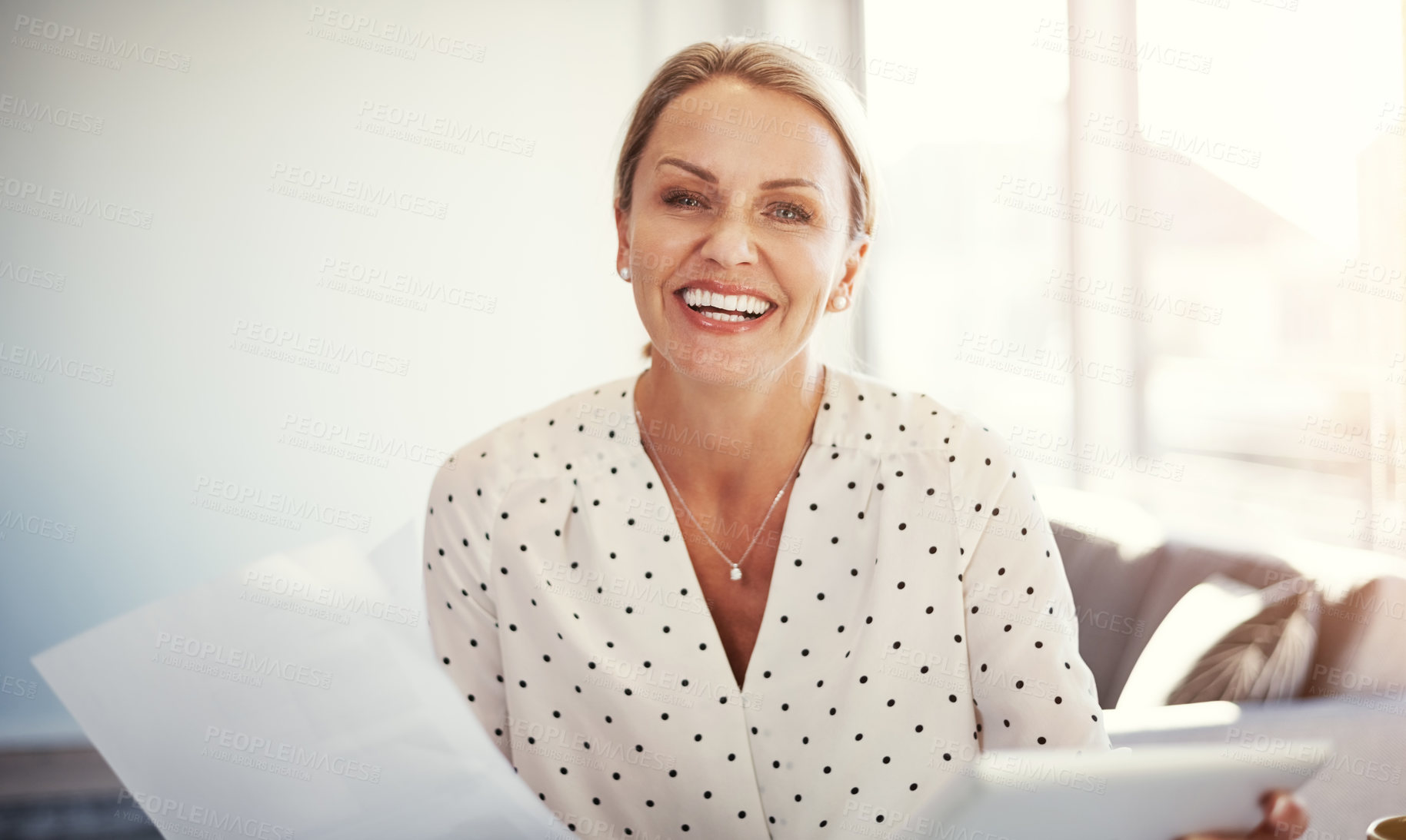 Buy stock photo Cropped shot of a mature businesswoman working from her home office