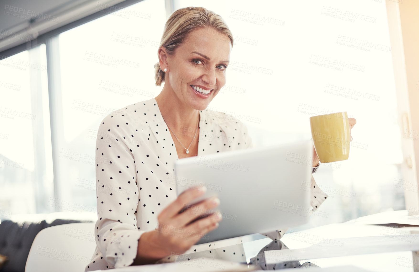 Buy stock photo Cropped shot of a mature businesswoman working from her home office