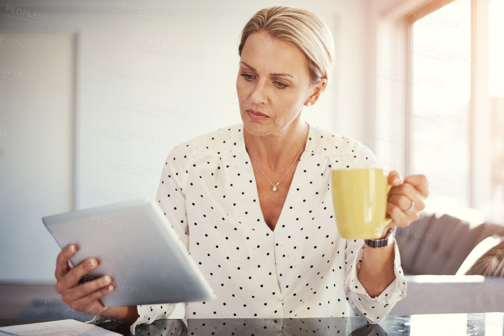 Buy stock photo Cropped shot of a mature businesswoman working from her home office