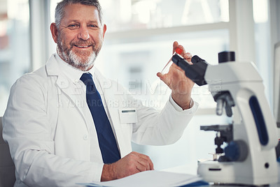 Buy stock photo Portrait of a mature man conducting medical research in a laboratory