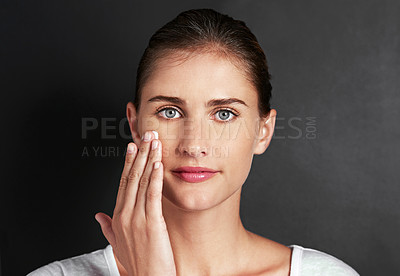 Buy stock photo Woman, portrait and cream in studio for skincare, beauty and glow on dark background. Cosmetic, confidence and glow for dermatology on backdrop for hydration, sunscreen and aesthetic glow.  