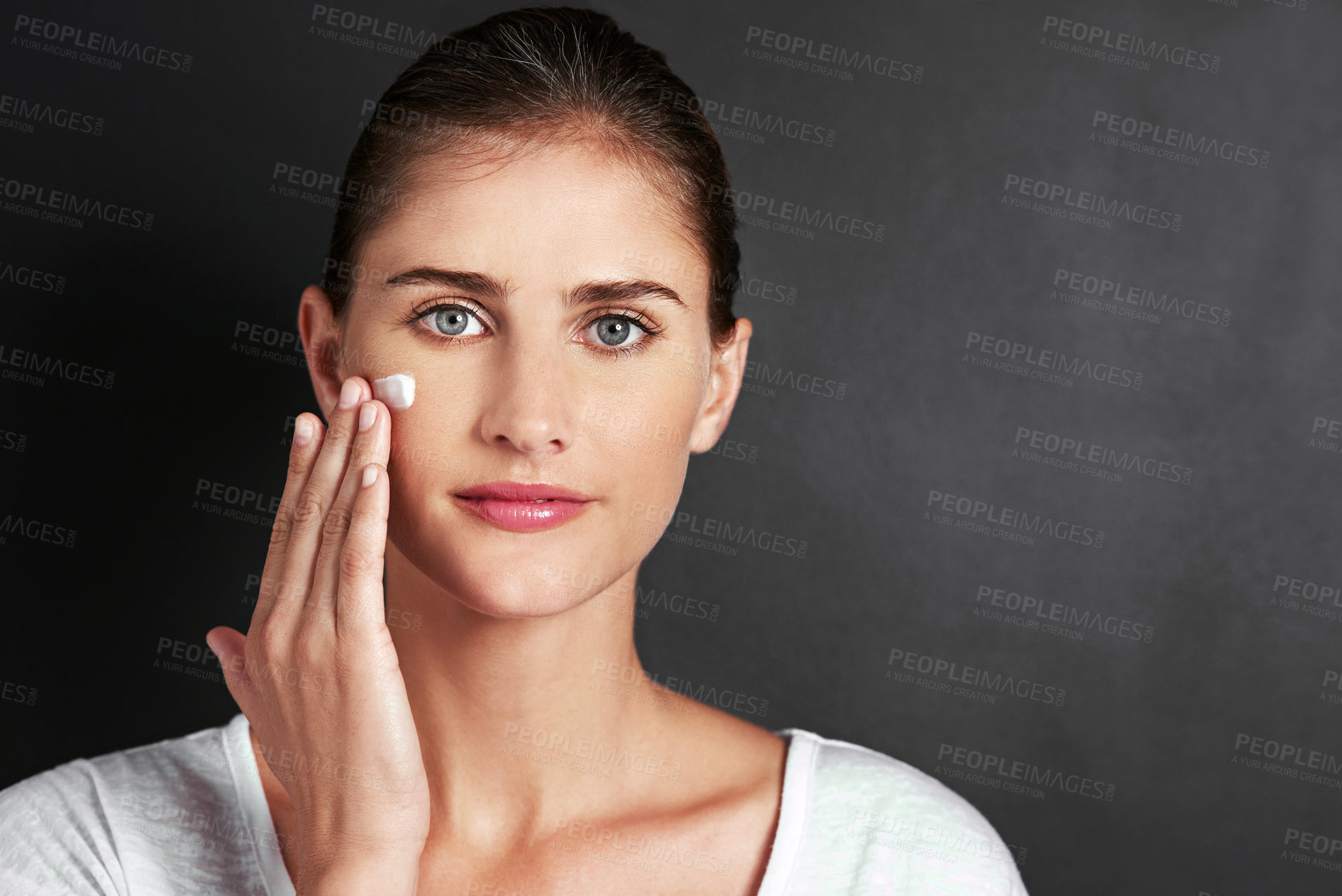 Buy stock photo Studio background, skincare and girl in portrait with moisturizer for face, care and healthy skin with mockup. Female person, facial routine or glow in morning with treatment or cosmetics or selfcare