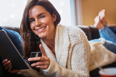 Buy stock photo Woman, portrait and tablet with debit card on sofa for online shopping, payment and saving plan. Female person, home and  living room on couch with smile for internet banking, investment and discount