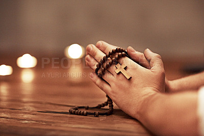 Buy stock photo Person hands praying holding a rosary with cross of Christian faith, religion or tradition in a religious church closeup and background. Man Catholic church with prayer hands and spiritual devotion