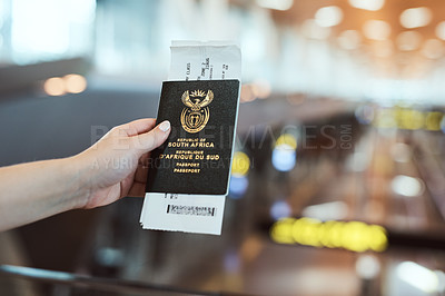 Buy stock photo Cropped shot of an unrecognizable woman holding her ID book in an airport