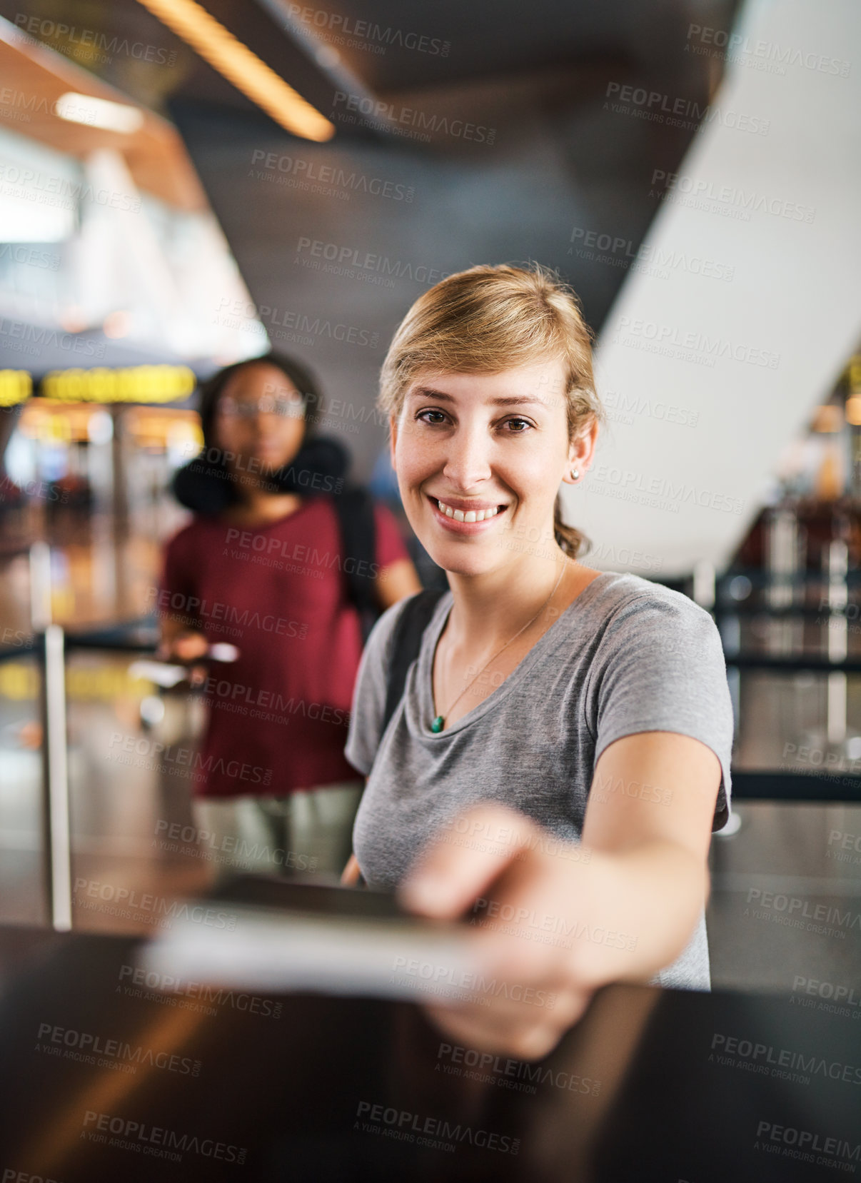 Buy stock photo Cropped portrait of an attractive young woman handing over her passport at a boarding gate in an airport