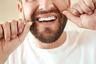Buy stock photo Cropped shot of an unrecognizable man going through his morning routine in the bathroom