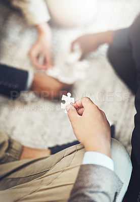 Buy stock photo Businessman, hands and puzzle piece in team building, meeting or problem solving together at office. Hand of man person in teamwork, jigsaw activity or collaboration for project together at workplace