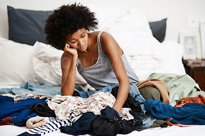 Buy stock photo Stress, burnout and laundry for black woman, overworked and headache from chores. Overwhelmed, bedroom and home for female person, frustrated and clothing for spring cleaning and fatigue from task