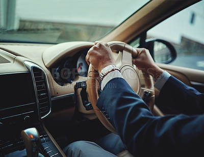Buy stock photo Cropped shot of a businessman driving a stylish car