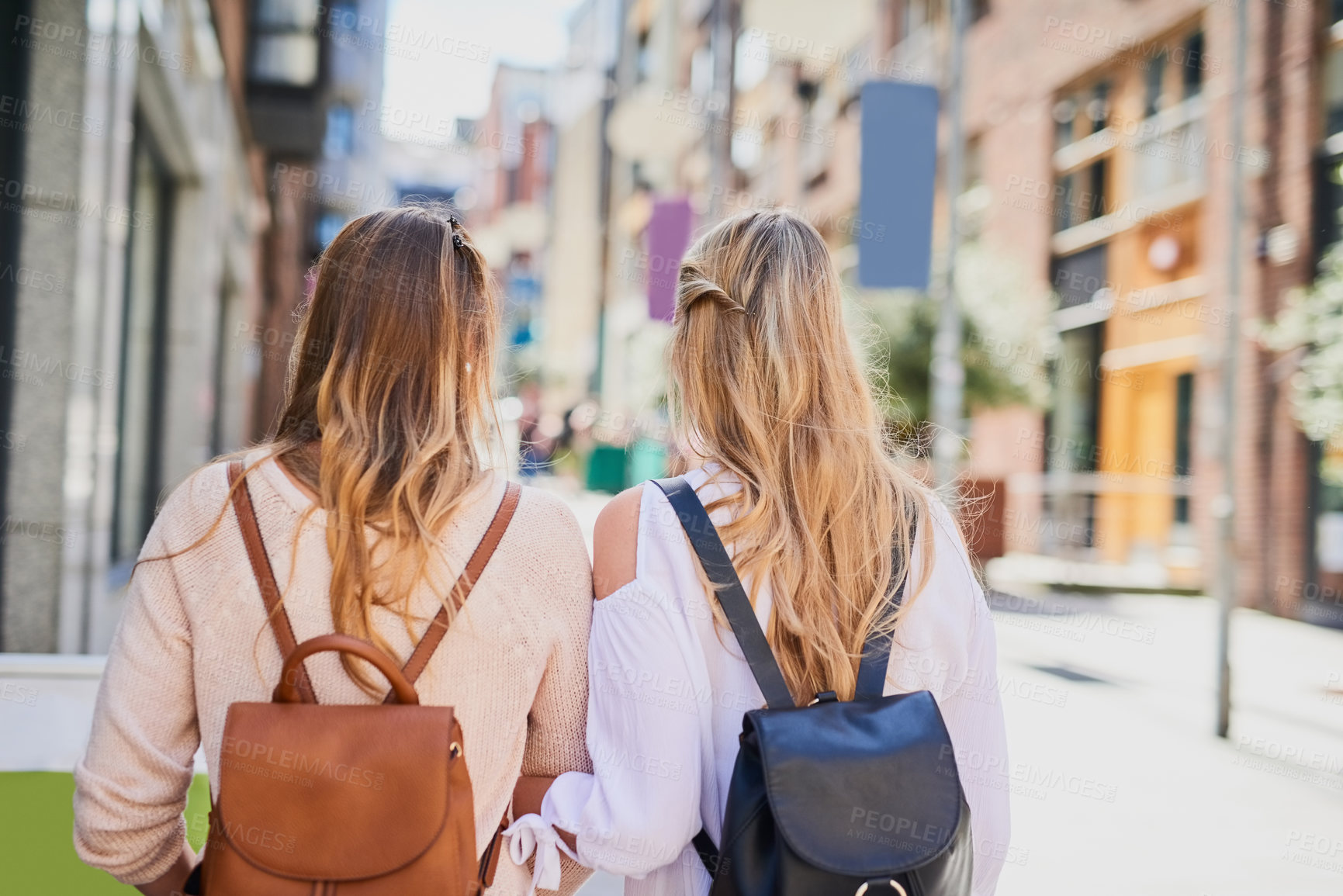 Buy stock photo Friends, women and travel with backpack in city for outdoor adventure, tourism and sightseeing together. Journey, walk and people by buildings in street for holiday, exploring and vacation in Italy