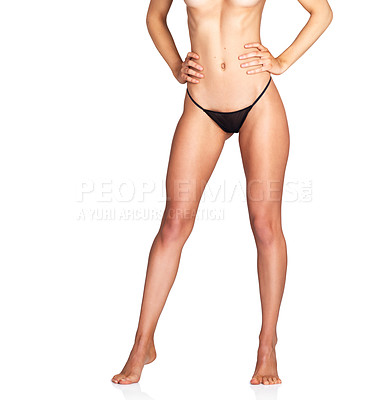 Buy stock photo Studio shot of an unrecognizable young woman in lingerie posing against a white background