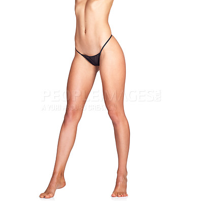 Buy stock photo Studio shot of an unrecognizable young woman in lingerie posing against a white background