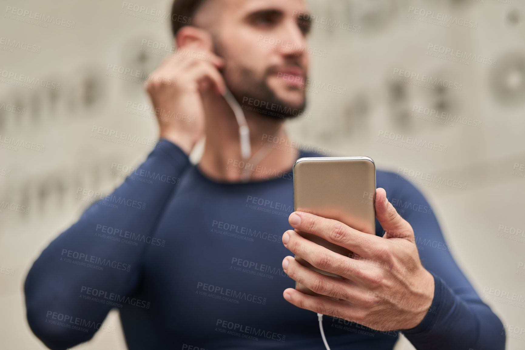 Buy stock photo Man, fitness and phone with earphones for audio, music or listening to online subscription or streaming. Young, active or male person thinking with headphones on mobile smartphone for sound podcast