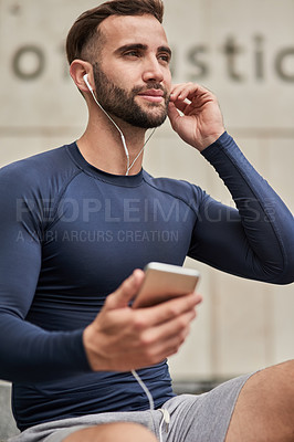 Buy stock photo Man, fitness and phone with earphones for podcast, music or listening on audio subscription or streaming. Young, active or male person thinking with headphones or mobile smartphone for sound playlist