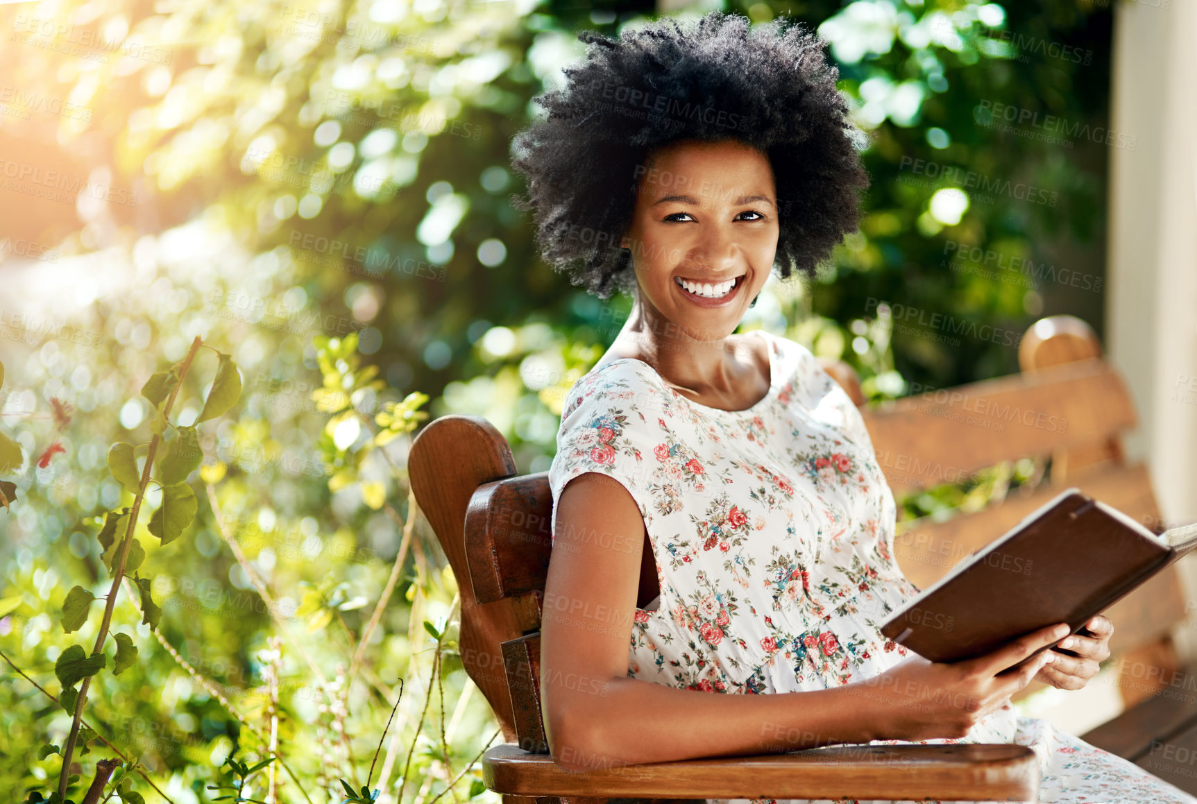 Buy stock photo African woman, happy and book on park bench in portrait to relax on vacation with story, language and learning. Girl, person and smile with novel, literature and holiday with sunshine in Atlanta