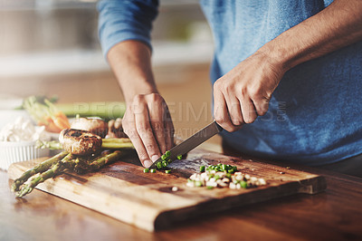 Buy stock photo Closeup of man cooking in kitchen, preparing food with fresh vegetables. Homemade lunch by vegetarian learning to balance nutrition for healthy lifestyle. Nutritionist make organic, gluten free meal
