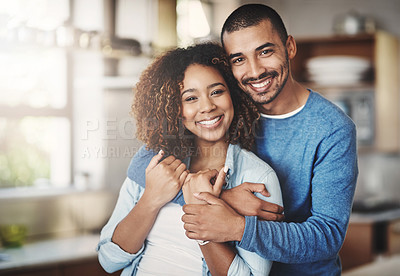 Buy stock photo Love, portrait and happy couple hug in kitchen of home with smile, embrace and healthy relationship. Happiness, man and woman hugging in affection, romance and care in marriage, young people in house