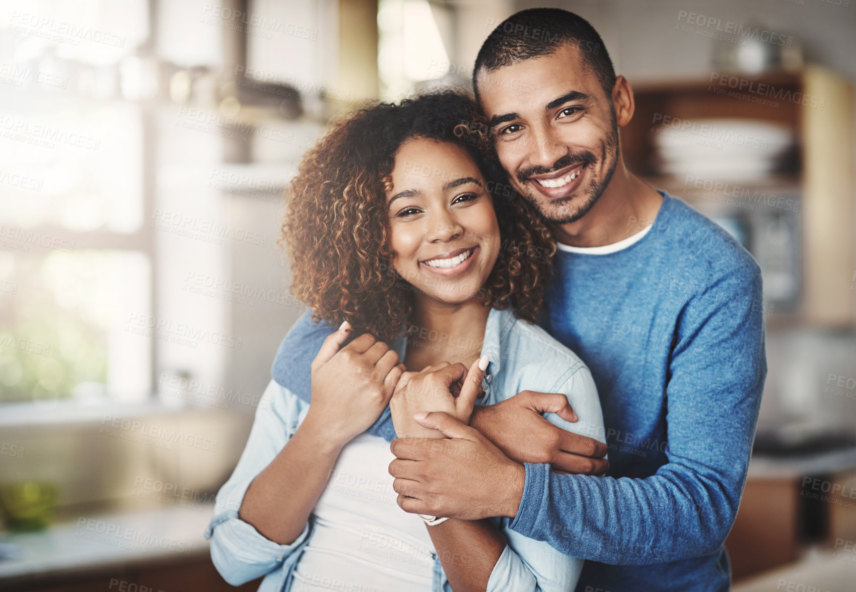 Buy stock photo Love, portrait and happy couple hug in kitchen of home with smile, embrace and healthy relationship. Happiness, man and woman hugging in affection, romance and care in marriage, young people in house